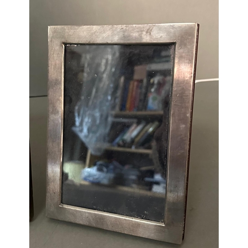 528 - Three silver photograph frames marked 925 (Largest 17cm x 22cm)