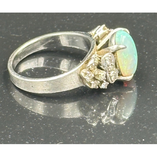 539 - An opal and diamond ring on 14k white gold, approximate total weight 5.5g.Size L