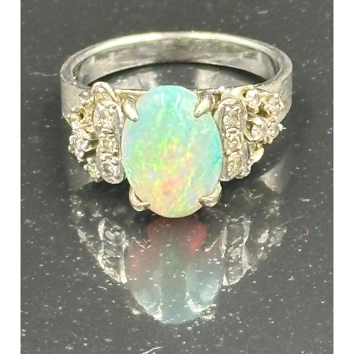 539 - An opal and diamond ring on 14k white gold, approximate total weight 5.5g.Size L