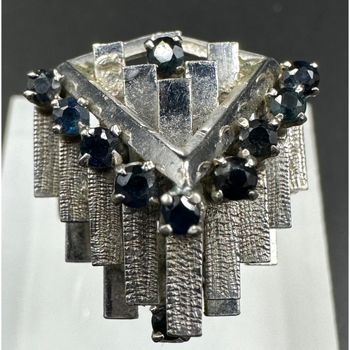 541 - A 14ct white gold fashion ring with sapphires, possibly 1970's, approximate total weight 8.6g Size M