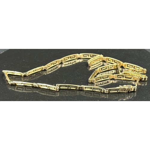 544 - A Greek key designed necklace in yellow gold marked 585, with an approximate total weight 11.9g