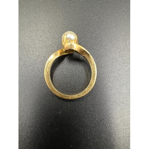 559 - Three gold pearl rings with an approximate total weight of 11g. Size K and L