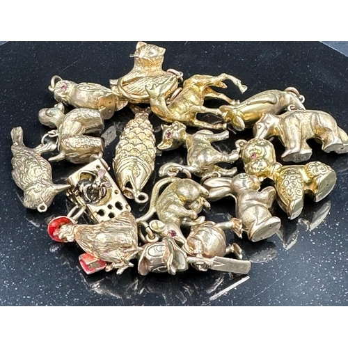 570 - A selection of fifteen 9ct gold charms featuring a wide variety of characters with a combined approx... 