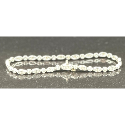 579 - Tiffany diamond bracelet mounted in platinum. Signed Tiffany 950. Total diamond weight approximately... 