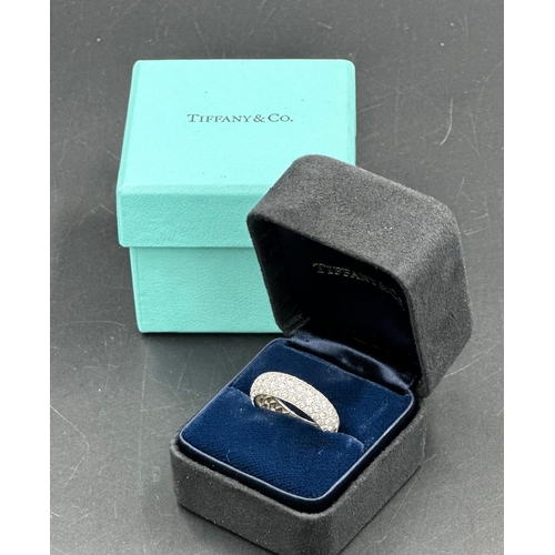 580 - Four row diamond eternity ring mounted in platinum. Signed Tiffany 950. Total diamond weight approxi... 