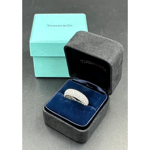 580 - Four row diamond eternity ring mounted in platinum. Signed Tiffany 950. Total diamond weight approxi... 