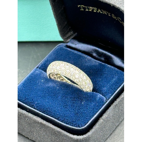 580 - Four row diamond eternity ring mounted in platinum. Signed Tiffany 950. Total diamond weight approxi... 