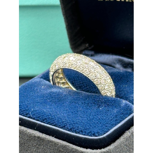 580 - Four row diamond eternity ring mounted in platinum. Signed Tiffany 950. Total diamond weight approxi... 