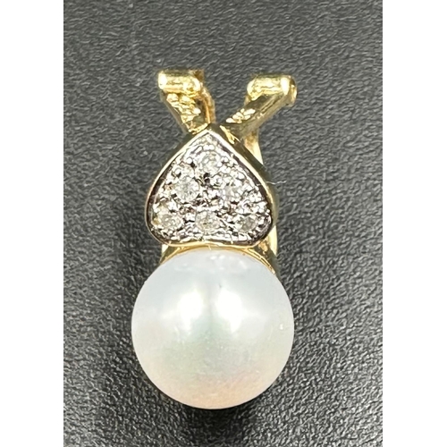 603 - A pair of 14ct gold pearl and diamond earrings