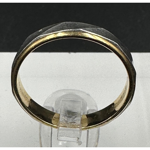 609 - An 18ct yellow gold and platinum wedding band style ring approximate weight 2.7g and size K.