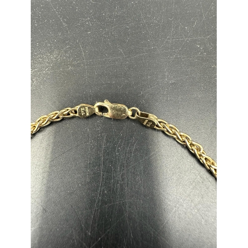 613 - A 9ct gold Figaro style chain (Total weight 18.2g)