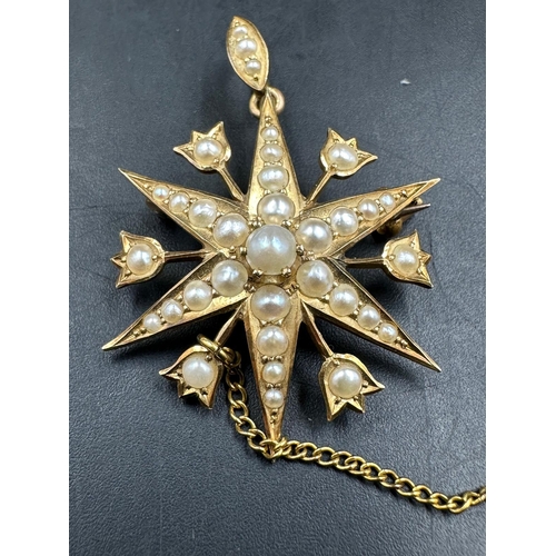 615 - A Victorian star brooch with seed pearl decoration on 15ct yellow gold, with an approximate weight o... 