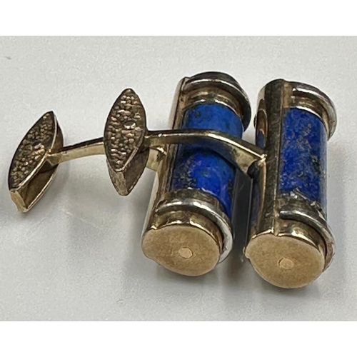 633 - A pair of cylindrical form lapis lazuli gents cuff links on 9ct gold 32mm in width and an approximat... 