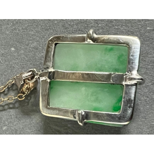 637 - A square jade pendant on a 9ct gold necklace.