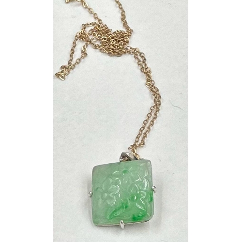 637 - A square jade pendant on a 9ct gold necklace.