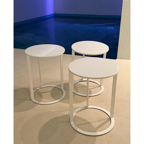 64 - Three white circular side tables