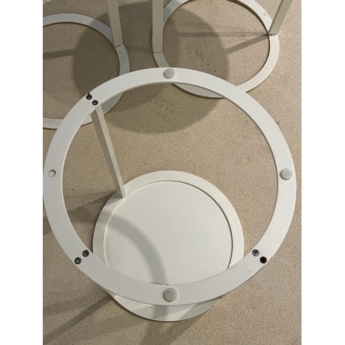 64 - Three white circular side tables