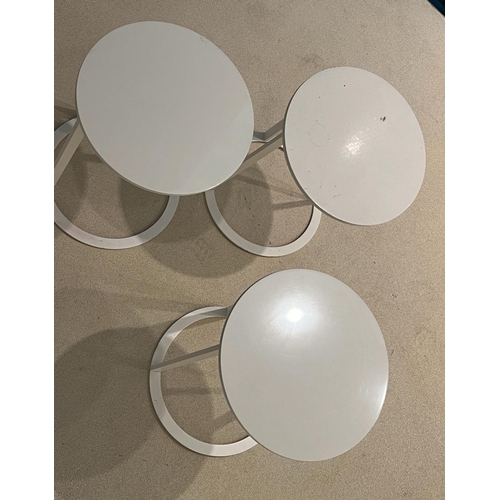 64 - Three white circular side tables