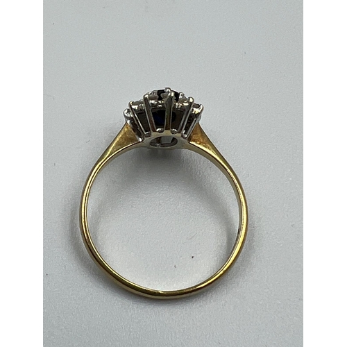 644 - A 9ct gold sapphire and diamond ring in a daisy style, approximate size L.