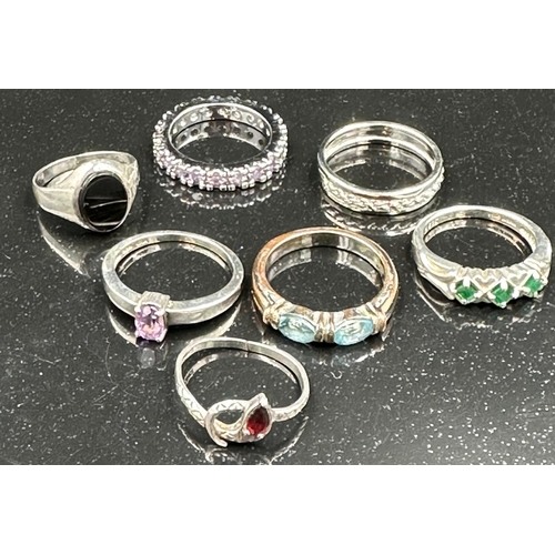 665 - A selection of seven silver fashion rings, various styles and finishes