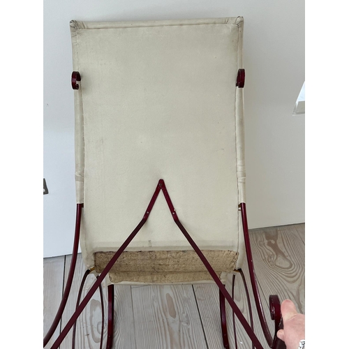 67 - A late Victorian rocking chair, upholstered later (H92cm W102cm D53cm)