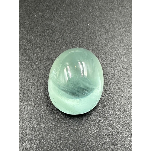 674 - A Natural Oval Cabachon aqua 21.9ct 19mm x 15mm