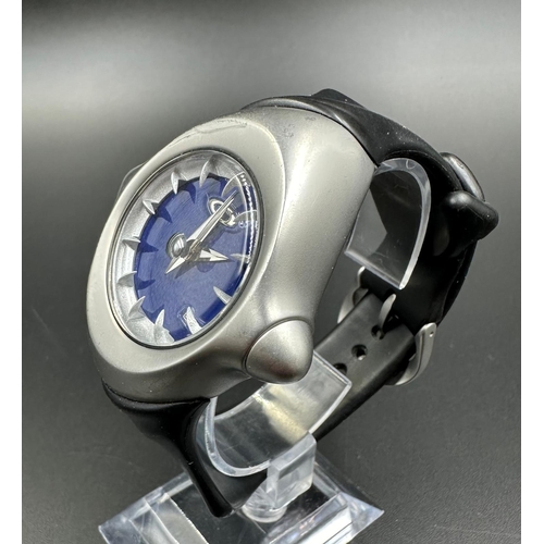 707 - A gentleman's Oakley wrist watch with a black rubber strap and blue enamel face