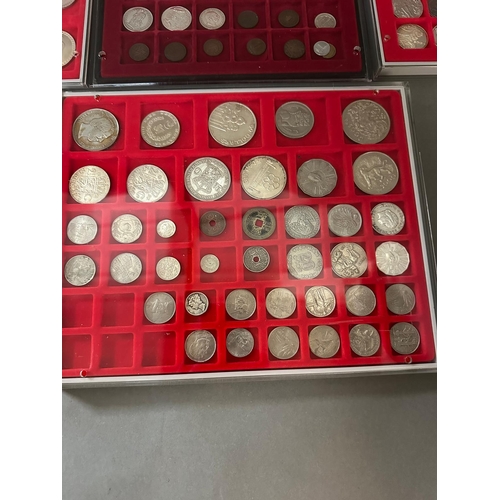 711 - A selection of world coins in seven trays, including Indian, Russian etc.