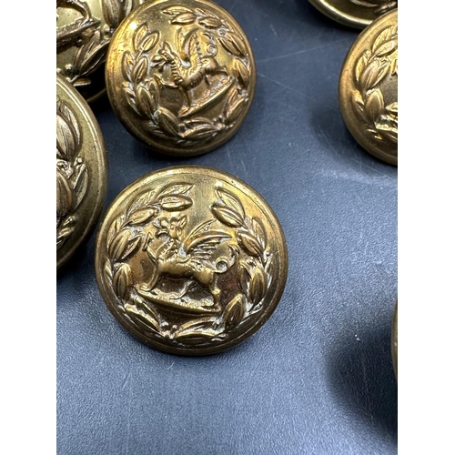 726 - A small selection of brass military buttons.