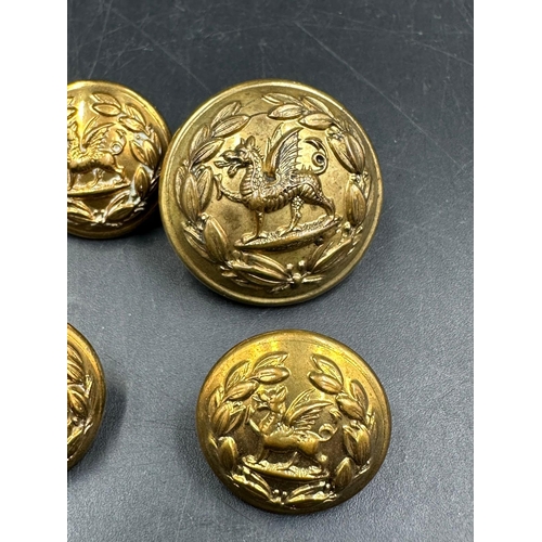 726 - A small selection of brass military buttons.