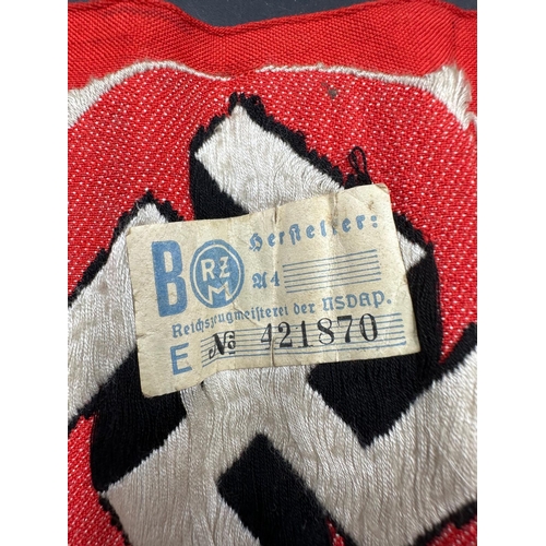 733 - A WWII era Nazi party arm band with RZM paper label to interior, numbered 421870