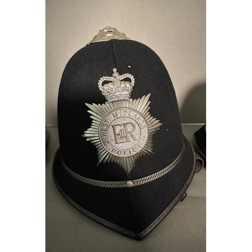 763 - Three vintage police helmets. Humberside, West Midlands and Devon and Cornwall forces