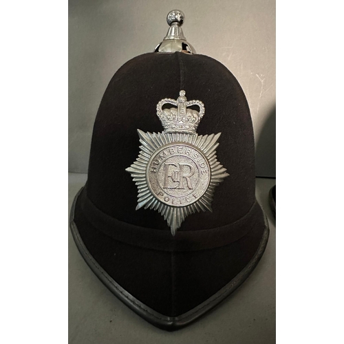 763 - Three vintage police helmets. Humberside, West Midlands and Devon and Cornwall forces