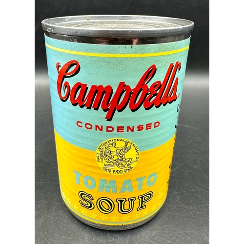 766 - A set of four Andy Warhol Foundation Campbells tomato soup cans, limited edition and a framed Campbe... 