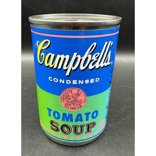 766 - A set of four Andy Warhol Foundation Campbells tomato soup cans, limited edition and a framed Campbe... 