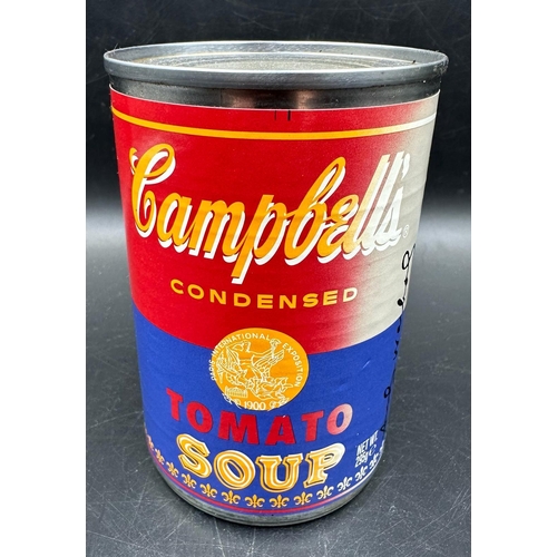 766 - A set of four Andy Warhol Foundation Campbells tomato soup cans, limited edition and a framed Campbe... 