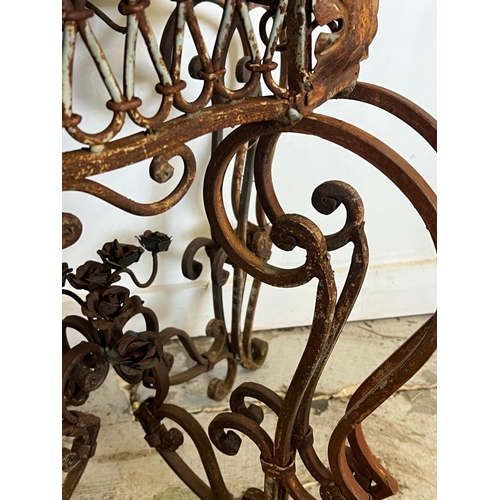 78 - A French marble topped circular table with scrolling iron twin legs (H78cm Dia66cm)