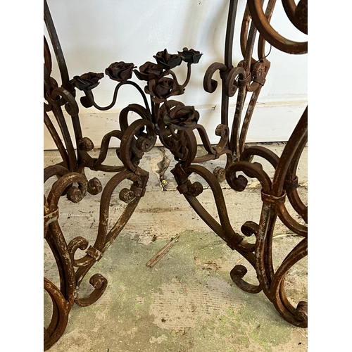 78 - A French marble topped circular table with scrolling iron twin legs (H78cm Dia66cm)