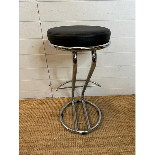 8 - Four black faux leather bar stools on chrome bases (H69cm)