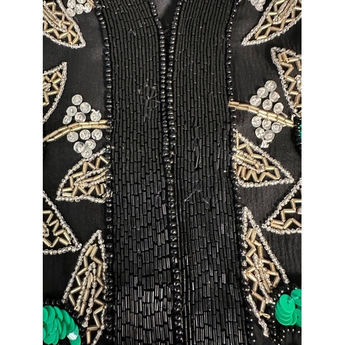 813 - A Frank Usher designer and beaded jacket