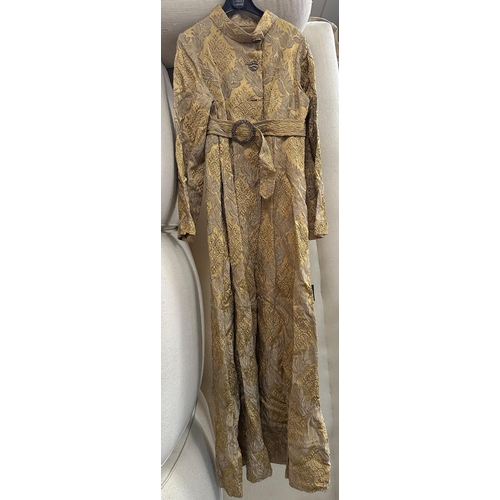 814 - A designer brocade frock coat with belt.