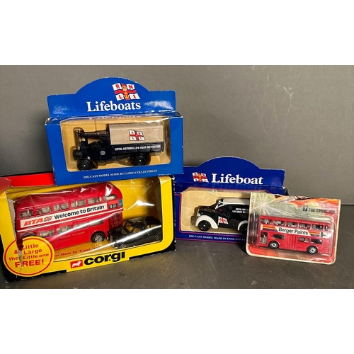 822 - Four boxed toy cars, Corgi lifeboats, a Corgi London bus and black cab and a Matchbox bus