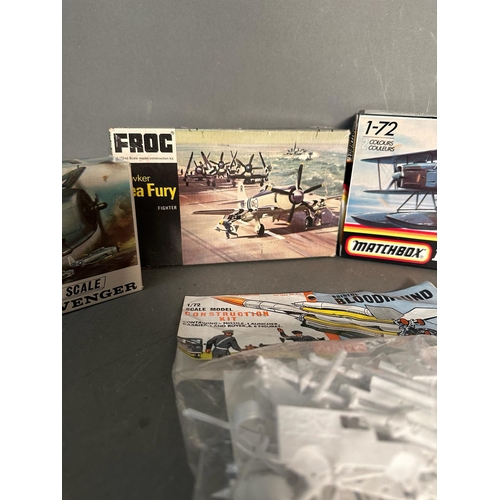 824 - A selection of boxed and unboxed model kits to include Matchbox, Airfix and Frog