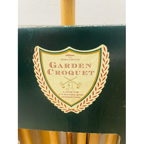 831 - A garden croquet set 