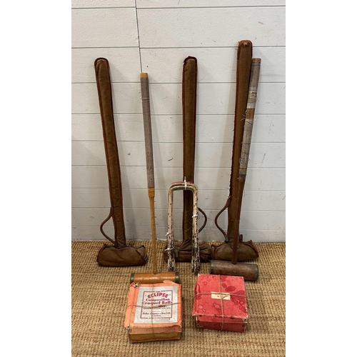 835 - A vintage croquet set to include mallets, hoops and balls