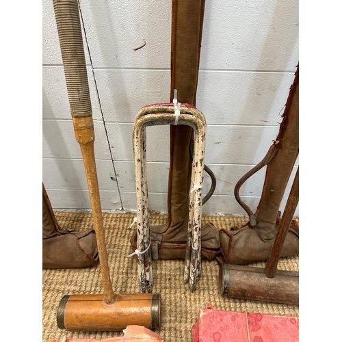 835 - A vintage croquet set to include mallets, hoops and balls