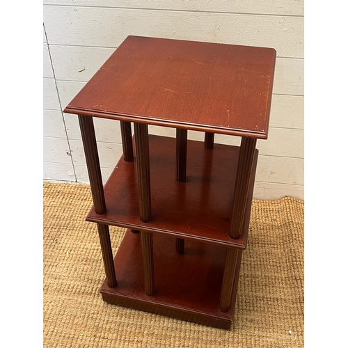 90 - A revolving mahogany bookcase (H71cm Sq41cm)