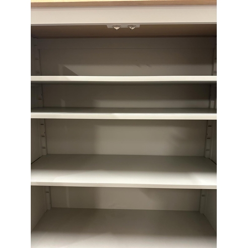 98 - A grey painted cupboard, two doors, three shelves with two long drawers under (H175cm W114cm D42cm)