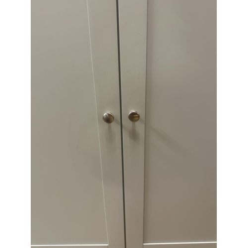 98 - A grey painted cupboard, two doors, three shelves with two long drawers under (H175cm W114cm D42cm)