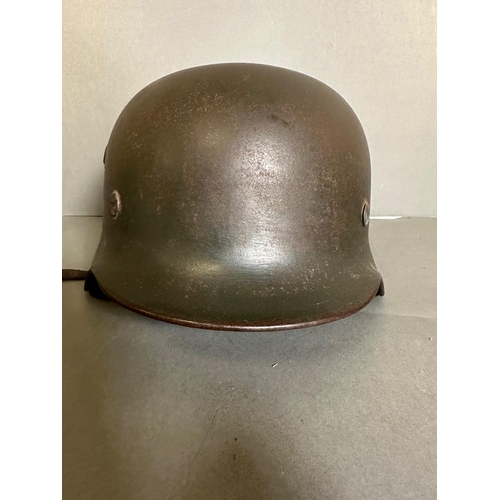 725 - A WWII German guards helmet